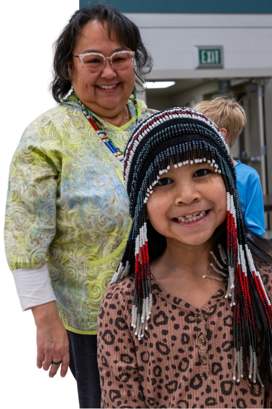 A youth wears a beaded headdress during the Alaska Native cultural history lesson.